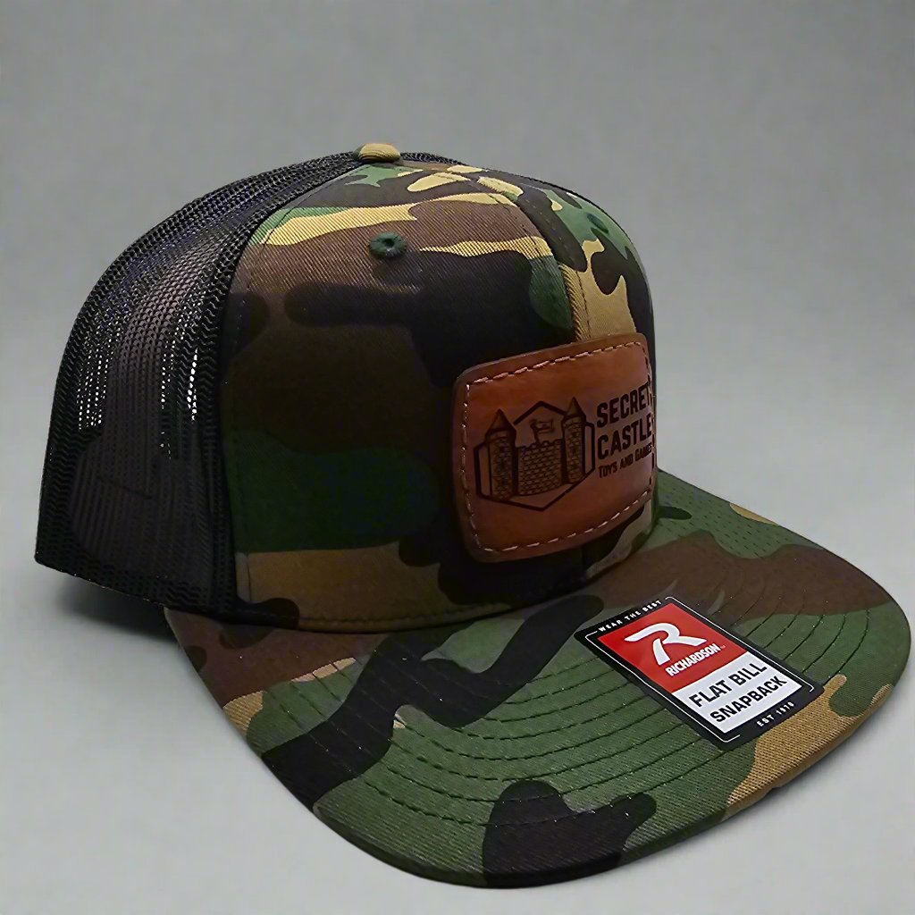 Woodland Camo Secret Castle Logo Mesh Trucker Cap